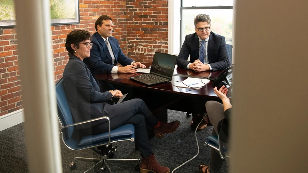 Gideon Asen attorneys at conference room table
