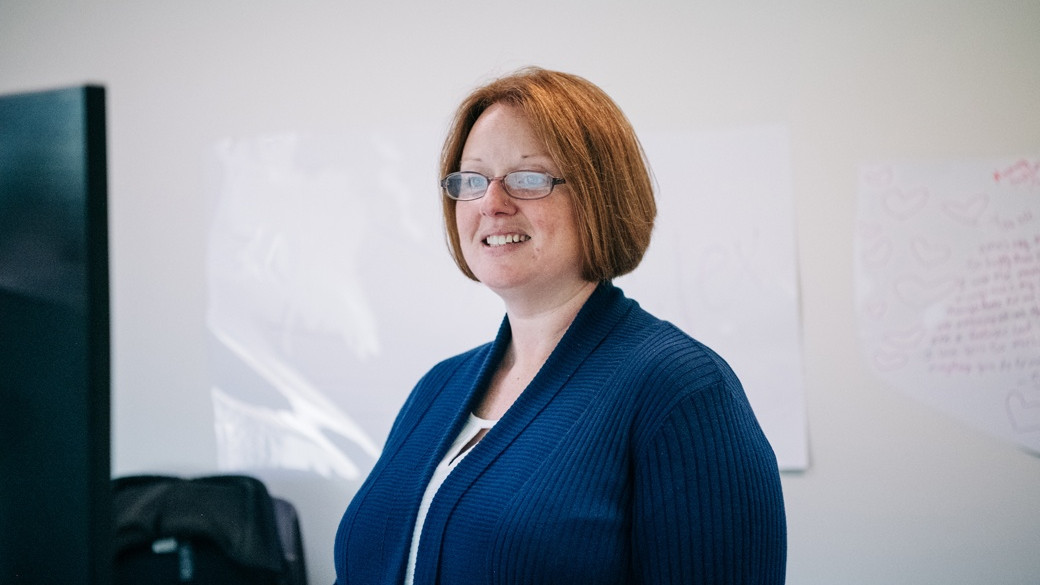 Christine Downs working as desk