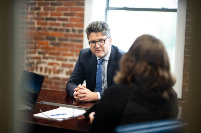 Taylor Asen in meeting with client