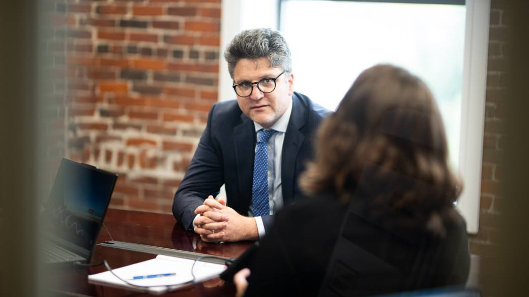 Taylor Asen in meeting with client