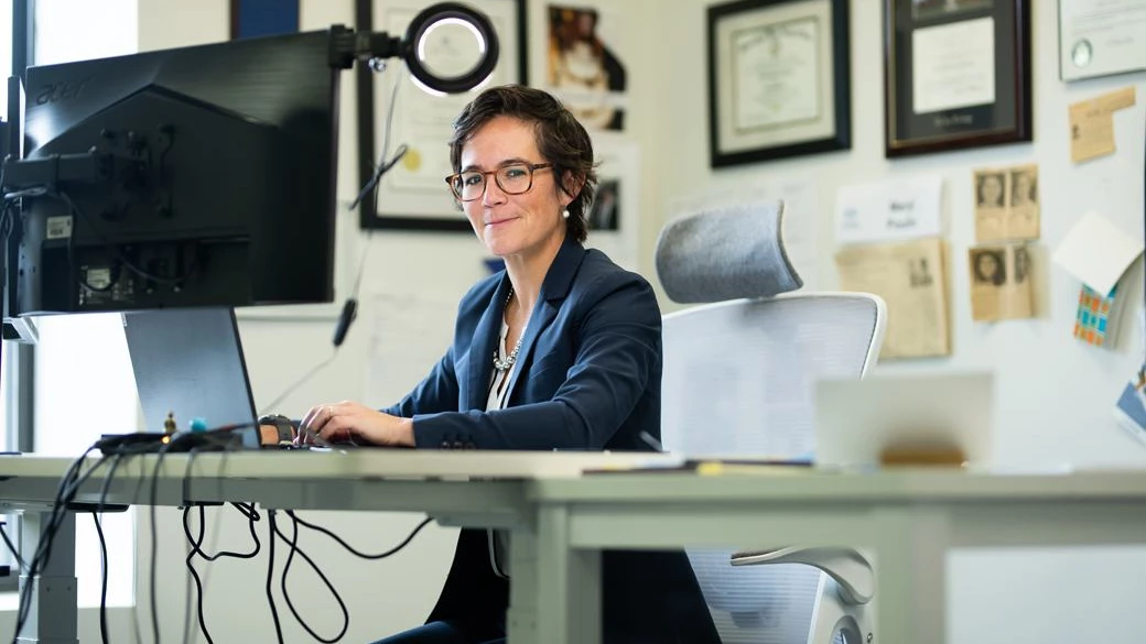 Meryl Poulin at desk