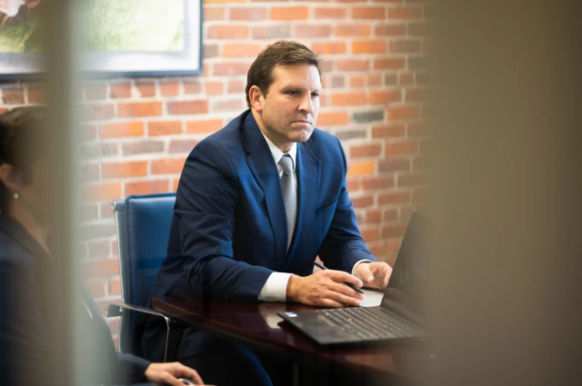 Attorney Ben Gideon at conference room table