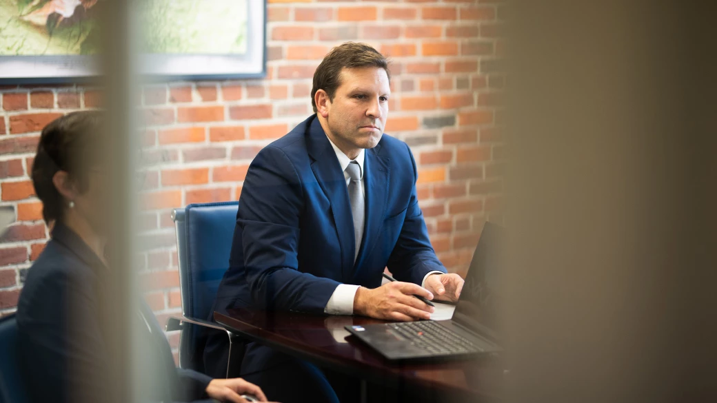Attorney Ben Gideon at conference room table